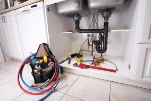 Plumbing services in Miami, Florida. Image shows various tools used for plumbing work.