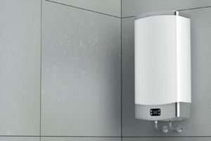 A white electric water heater installed in a modern bathroom setting