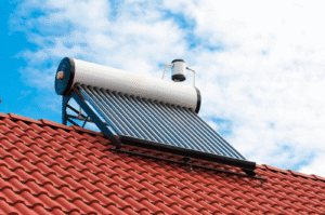 A rooftop solar water heater on a house utilizing solar power to provide hot water efficiently