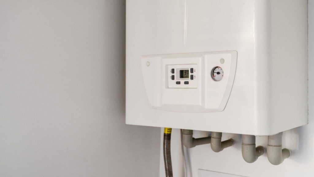 A modern gas boiler on a wall equipped with a control panel for heating management